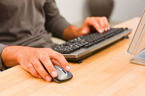 Man Using Mouse and Keyboard